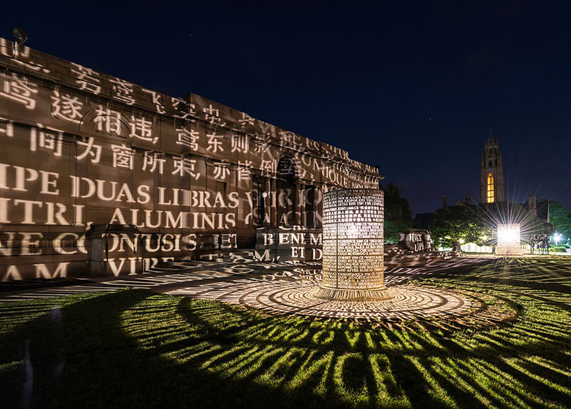 nighttime view of Memorial Art Gallery artists light display reflecting on MAG buildings.