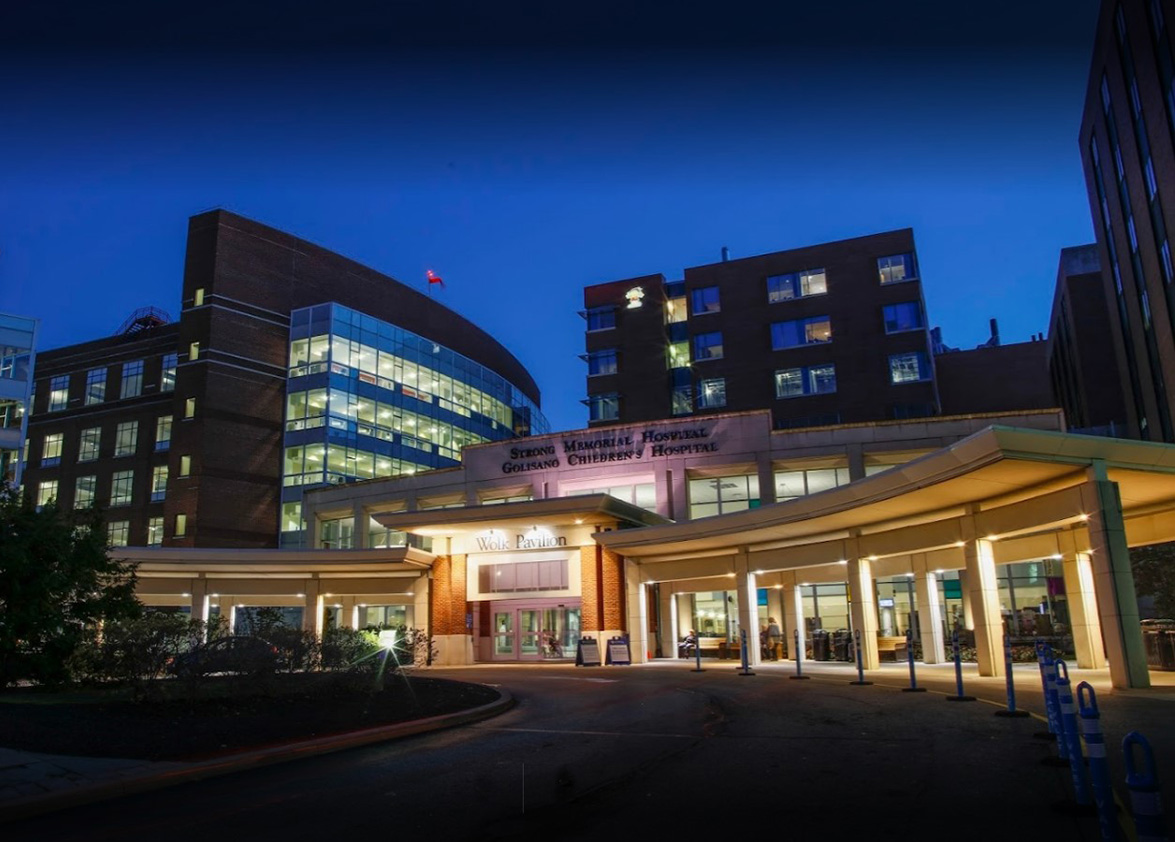 nighttime front view of strong memorial hospital entrance.