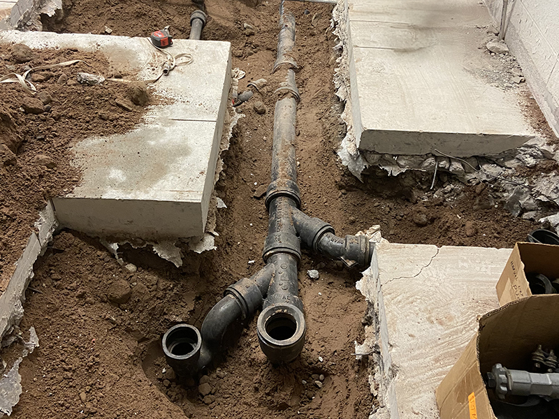 underneath of concrete floor exposed to show piping.